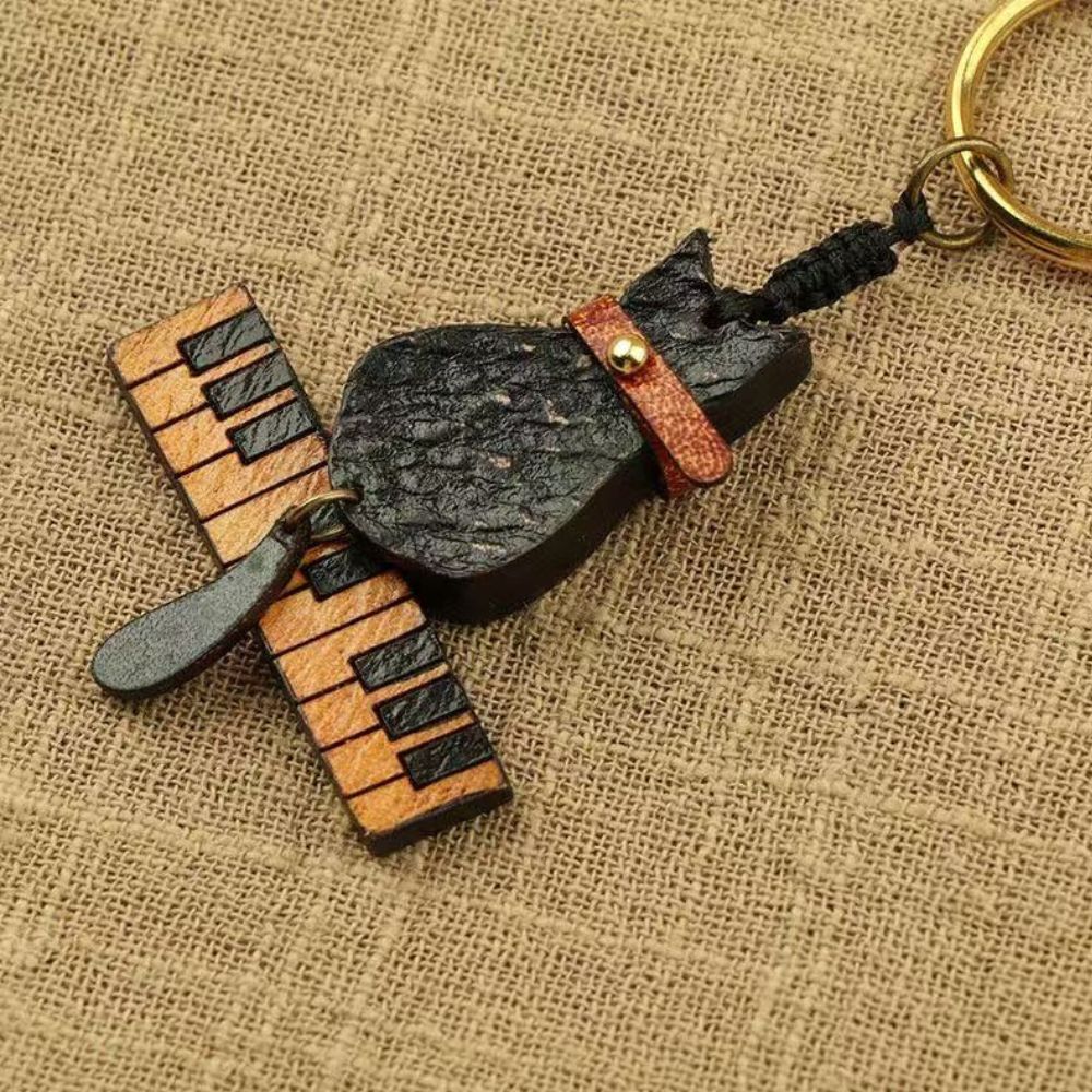 猫 キーホルダー 本革 ピアノ 猫モチーフ 魚の骨 鈴付き レザー バッグチャーム キーリング 音楽 楽器 ねこ ネコ おしゃれ かわいい プレゼント ギフト