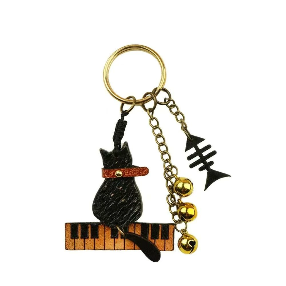 猫 キーホルダー 本革 ピアノ 猫モチーフ 魚の骨 鈴付き レザー バッグチャーム キーリング 音楽 楽器 ねこ ネコ おしゃれ かわいい プレゼント ギフト